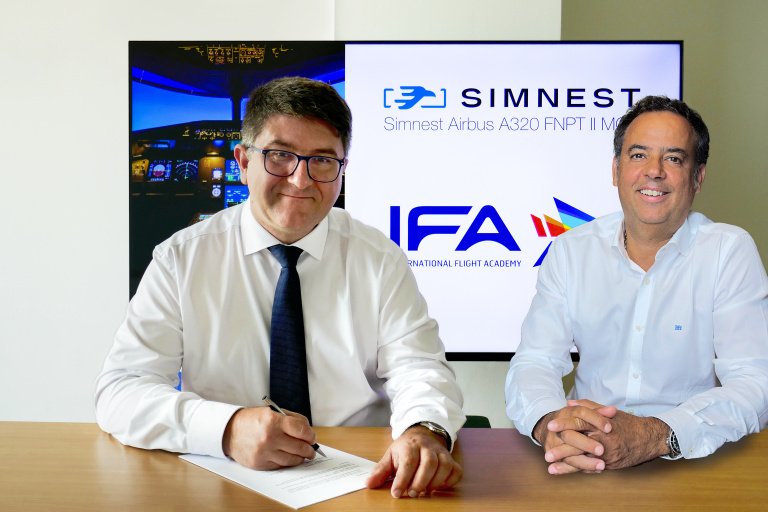 Simnest and IFA CEOs sitting at a table